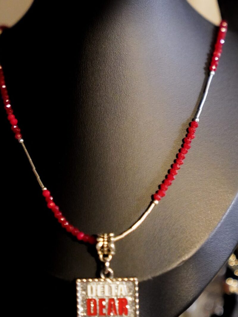 Style D05 – Dainty faceted red crystal and silver liquid-tube strand, rhinestone DELTA DEAR plaque pendant