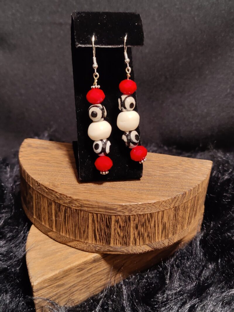 Style E01 – red faceted crystal rondelles, black & white dzi eye beads, cream bone rounds, silver bead caps, silver hooks