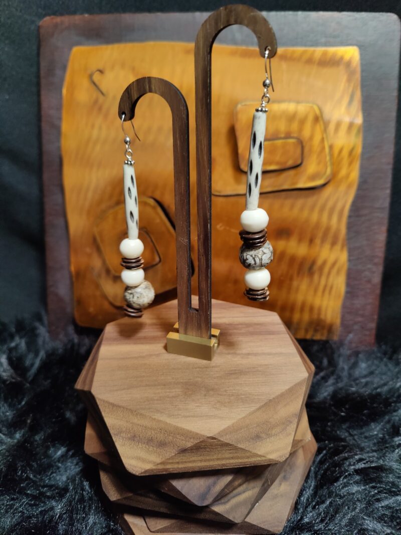 Style E02 – carved bone tube, cream bone rounds, picture jasper round, coconut shell disc spacers, silver hooks