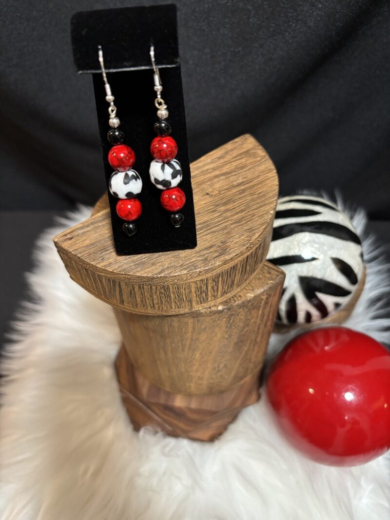 Style E04 – red marbled rounds, black & white cow-print round, black onyx rounds, silver hooks