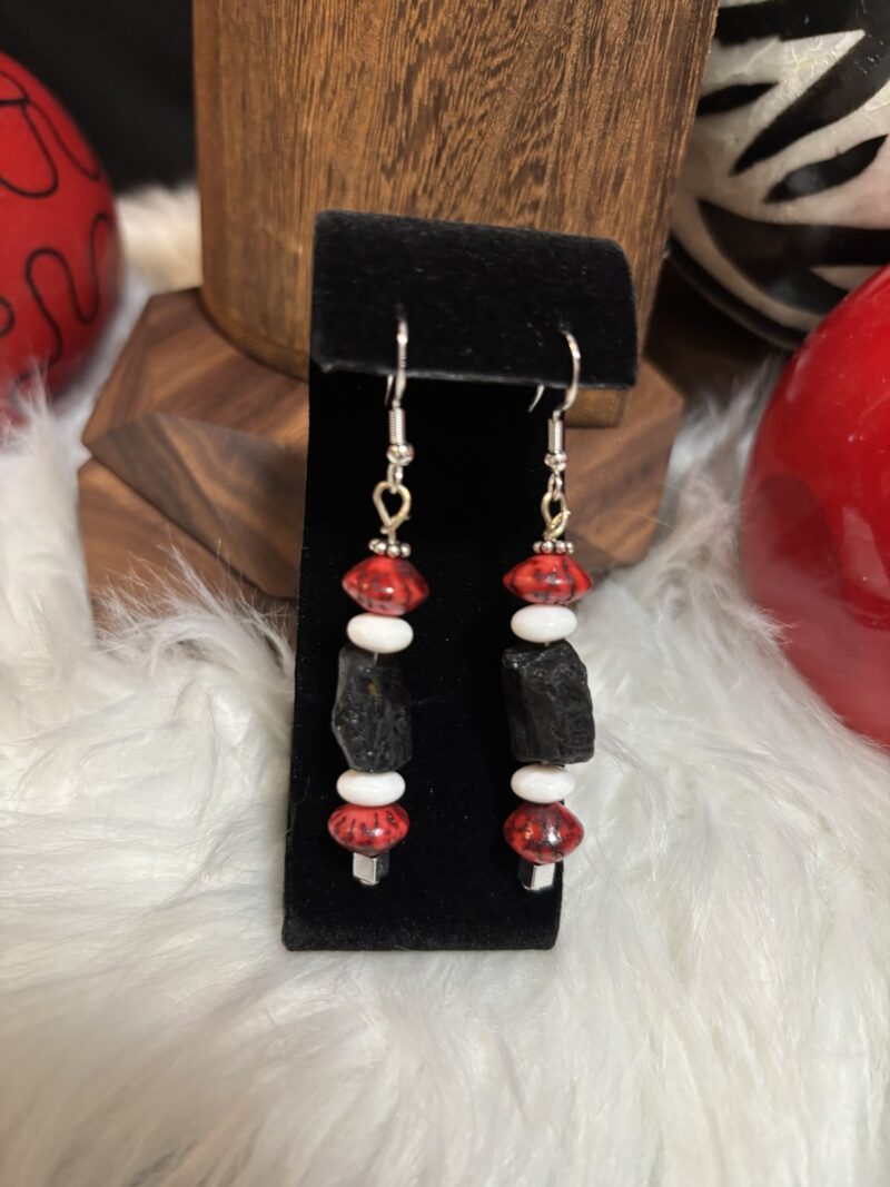 Style E16 – black lava rock nugget, red crystal saucers, white rondelles, silver hooks
