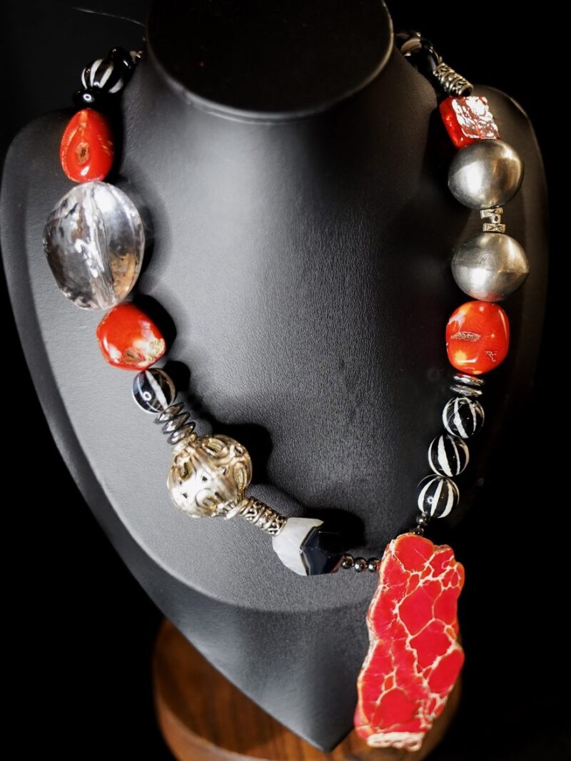Style N03 – Asymmetric statement: red bamboo coral nuggets, large clear quartz, antique silver rounds and filigree bead