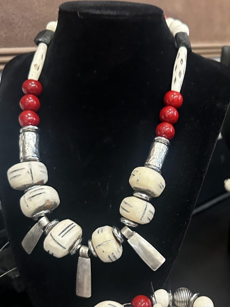 Style N09 – Carved bone pipe beads, black lava, red rounds, hammered silver tubes