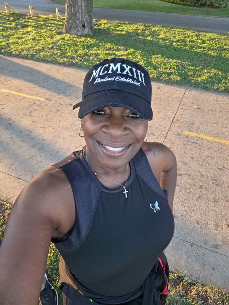 Nina wearing the black distressed MCMXIII Standard Established dad cap